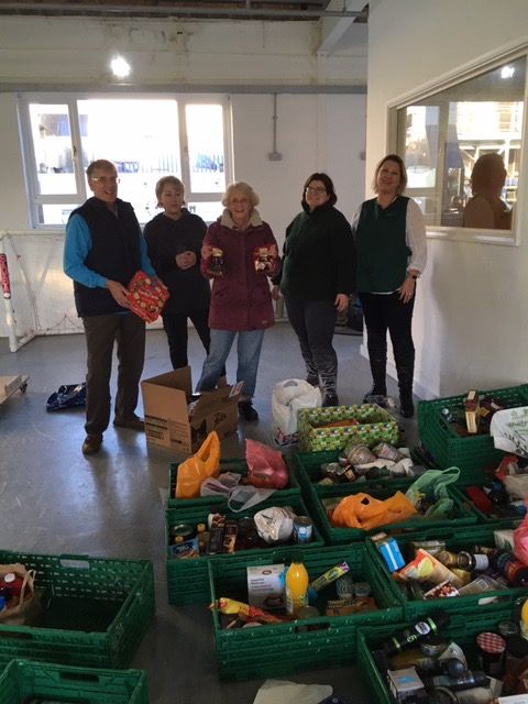 Foodbank staff receiving the delivery 