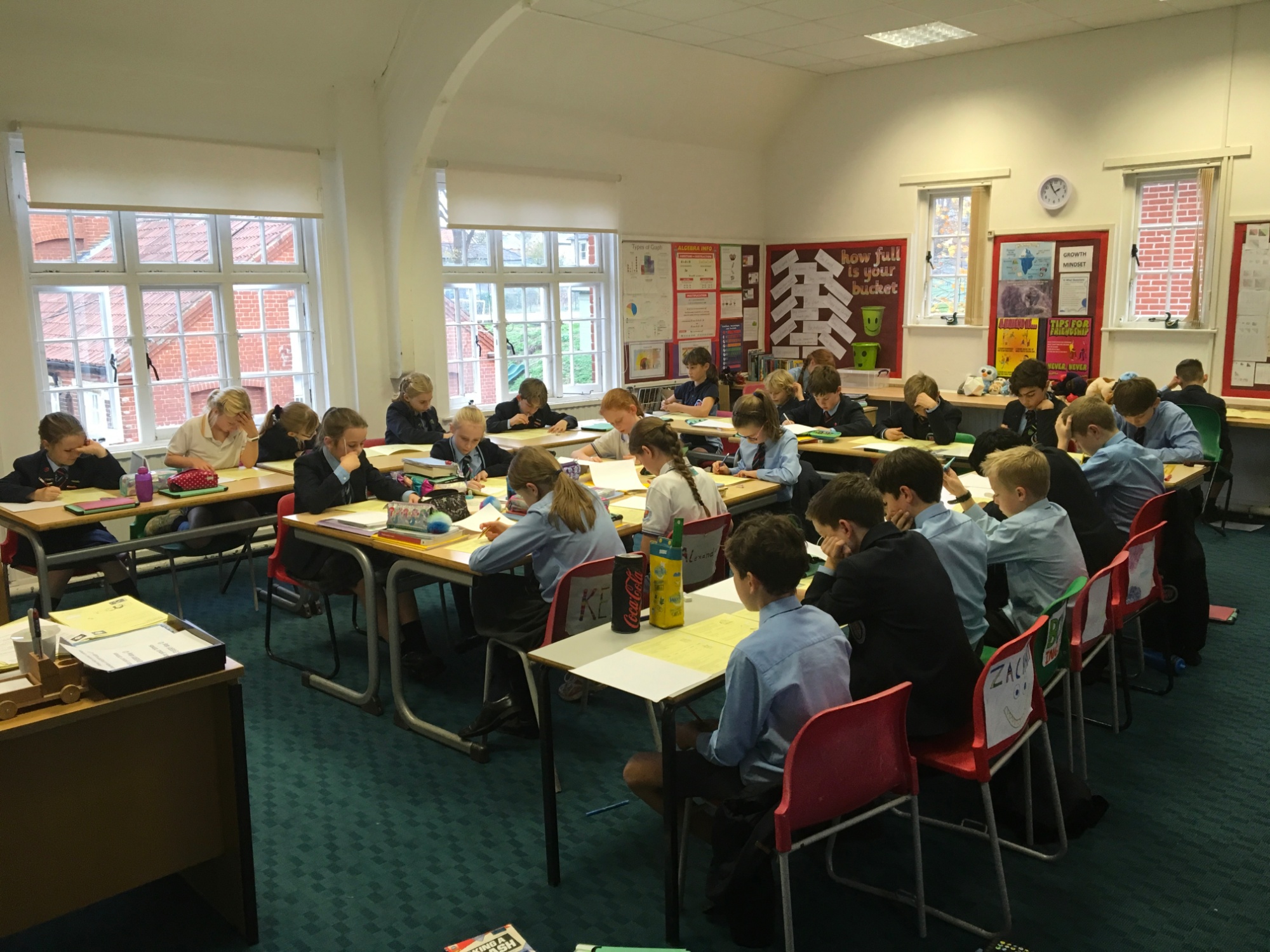 Pupils concentrating on the Primary Maths Challenge