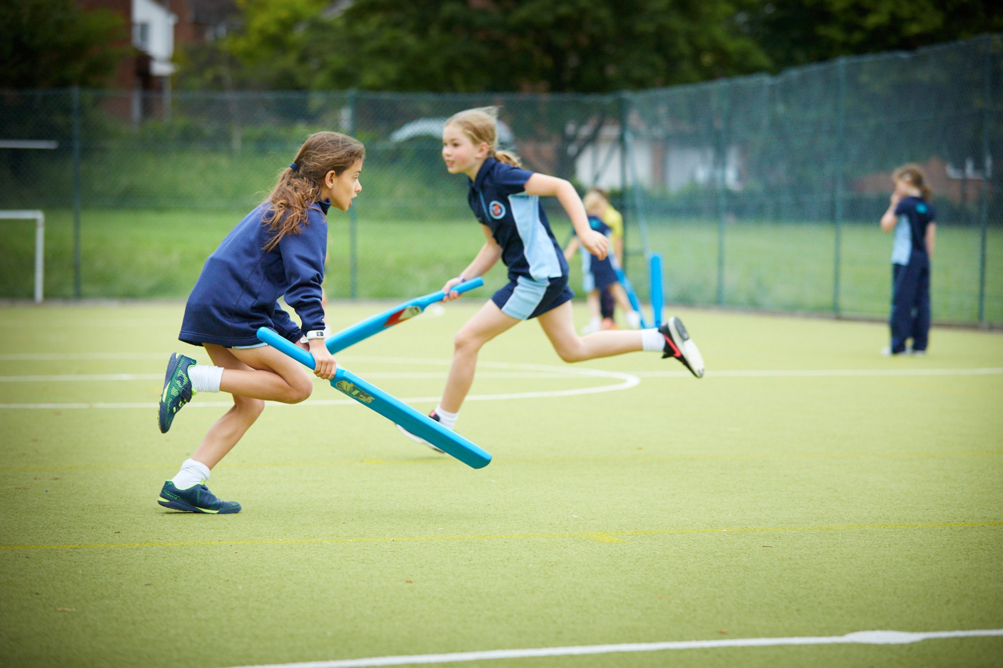Image of students playing sport to illustrate link to 'Sports' page