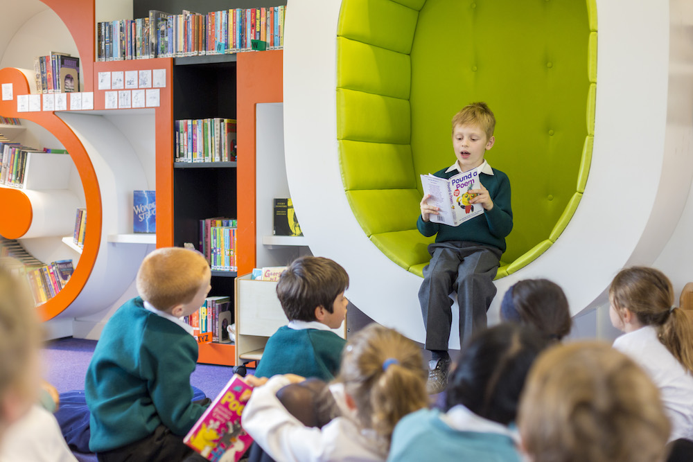 Image of pupils in library to illustrate link to 'Visit Us' page