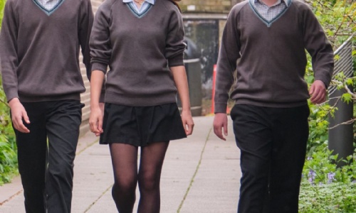 Three Senior School students walking on campus